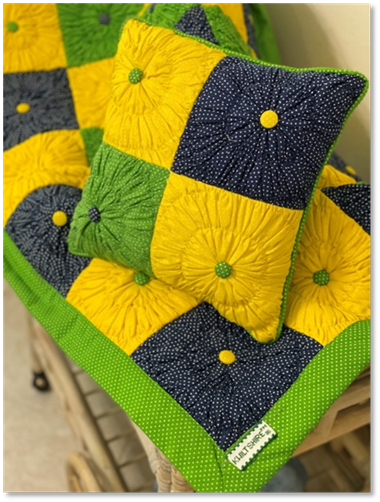 A yellow and green pillow with polka dots on it

Description automatically generated